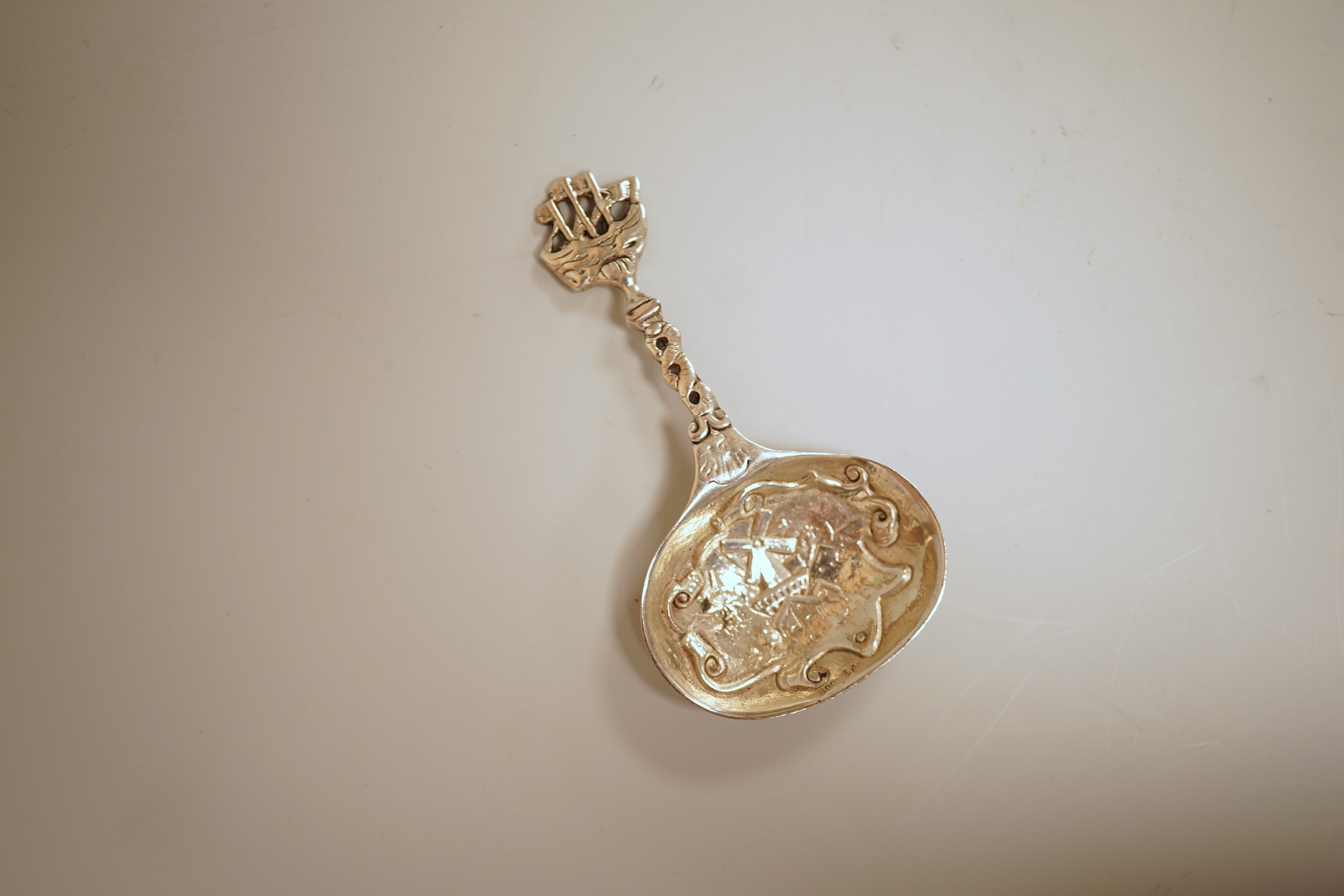 A pierced 800 standard white metal fruit bowl, diameter 23.6cm, a silver mounted hand mirror and two brushes, a 19th century continental white metal pyx, a pair of George V silver mounted whisky noggins, Birmingham, 1925